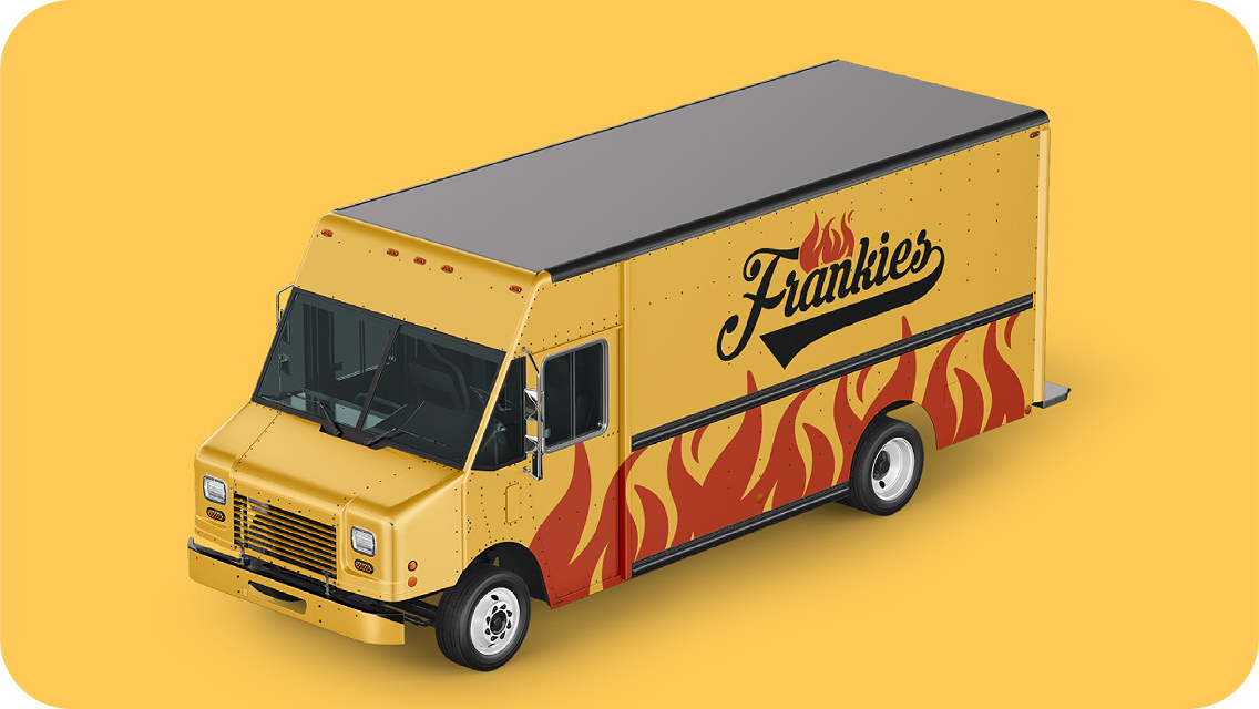 Yellow food truck with red flame graphics and Frankies logo